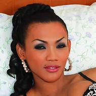 Asian T-girl plays with man meat